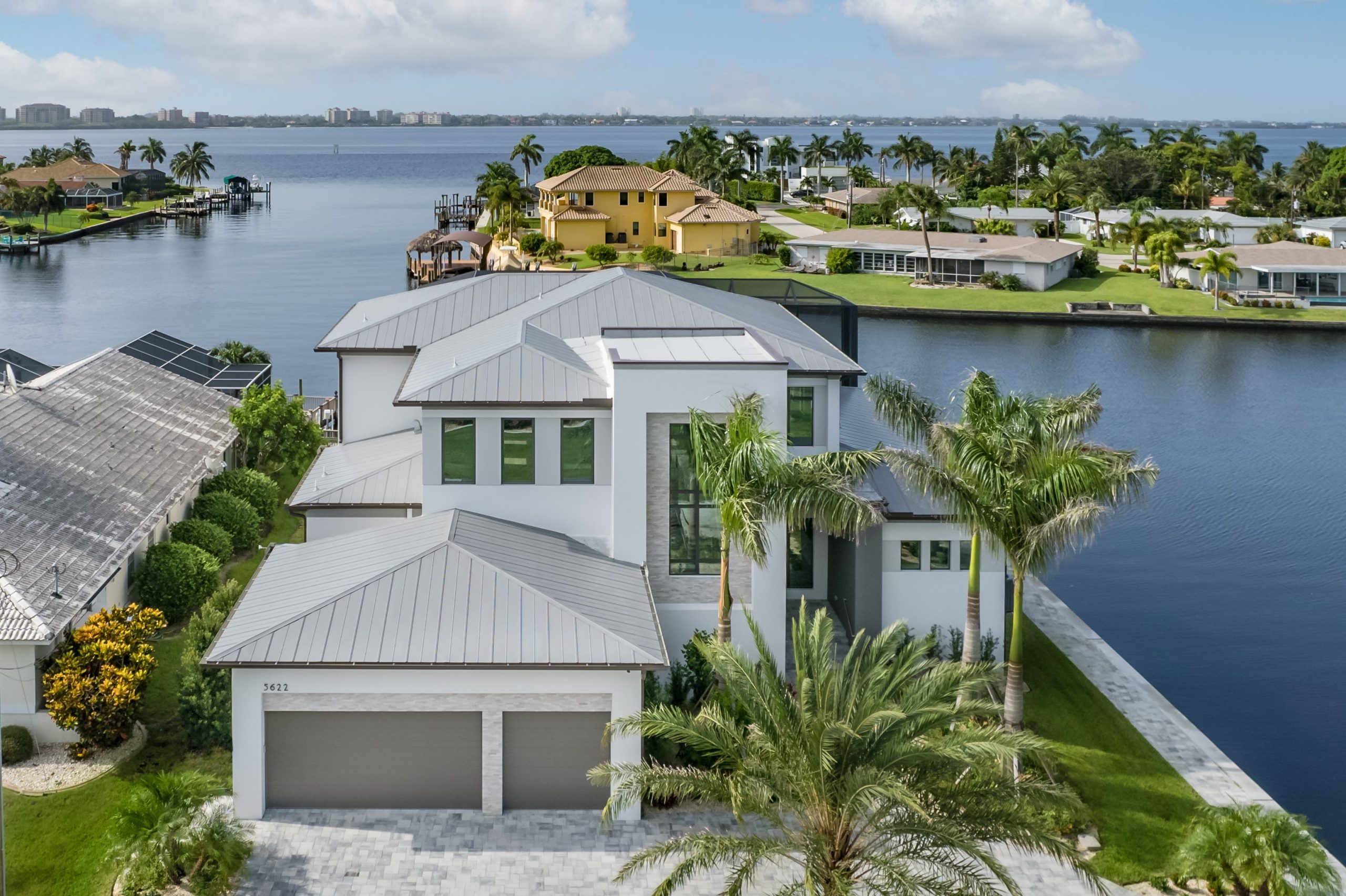 Exterior of a custom home built by Aubuchon Homes along a direct Gulf access waterway in Cape Coral, FL.