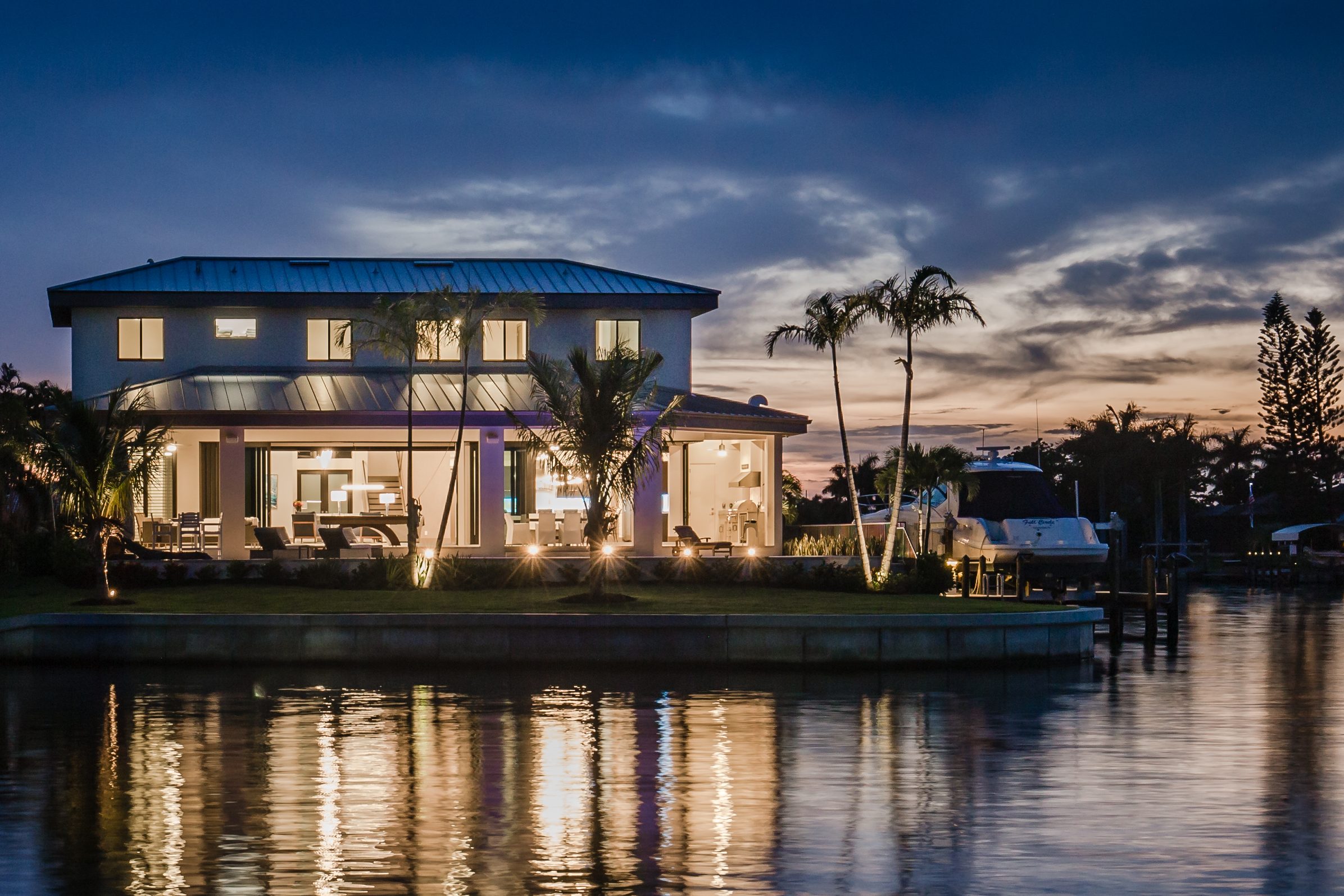 Exterior of a Cape Coral Custom Home built by Aubuchon Homes along a direct Gulf access canal.